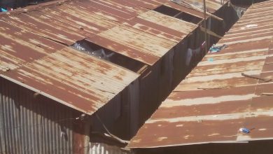 Photo of Kawangware: Landlords removing iron sheets to force tenants to pay rent.