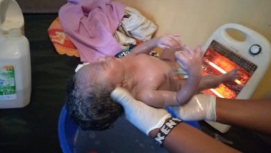 Photo of A one day old child rescued from a pit latrine by Kawangware youths led by Simon Tiema