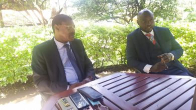Photo of Alex Kidake ready to fly the Ford Kenya flag during the VIHIGA county gubernatorial race in 2022.