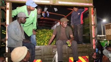 Photo of Igathe in an early morning tour of Marikiti market to drum up support.